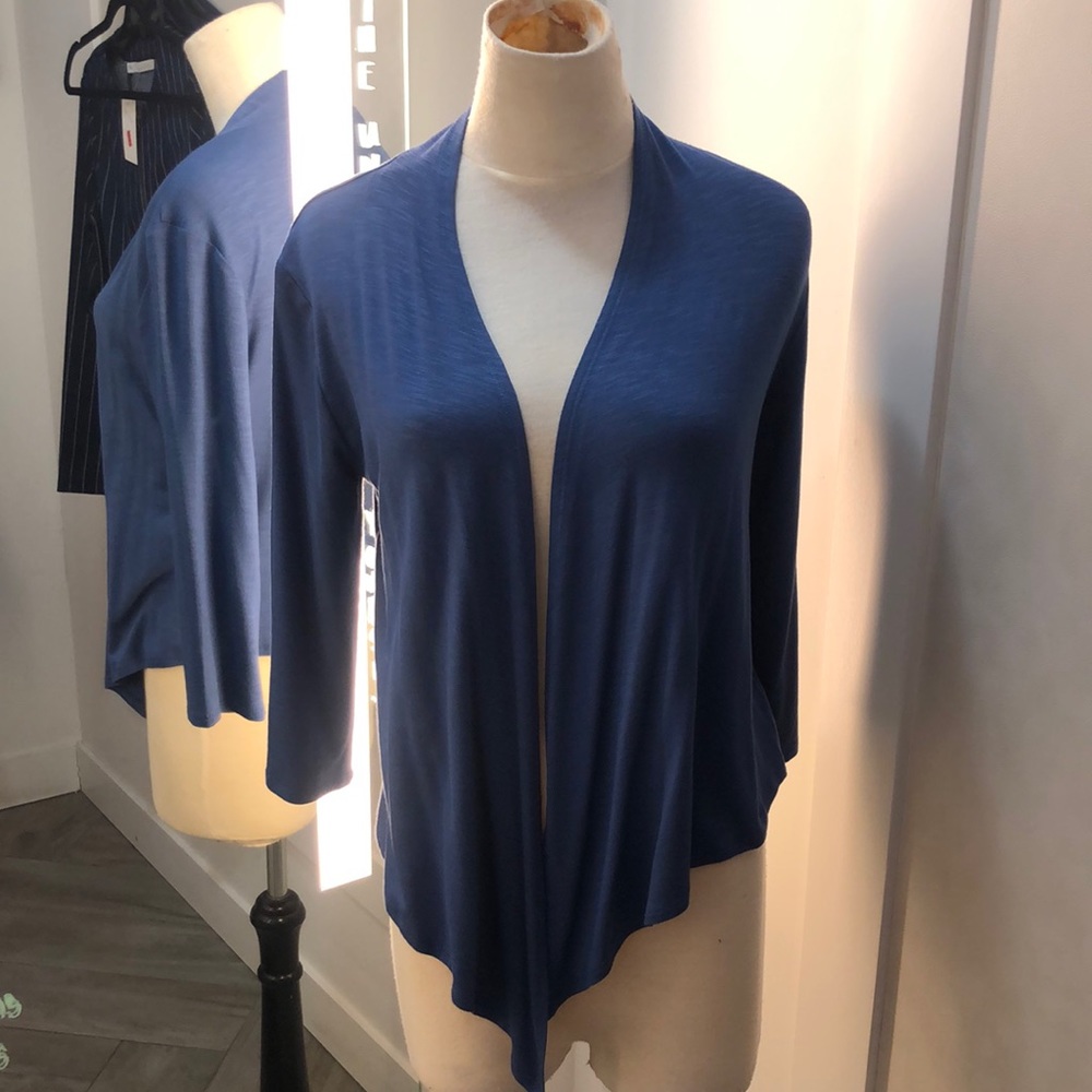A blue long sleeved cardigan